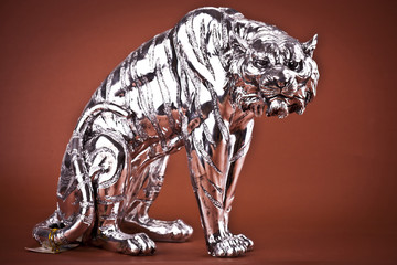 Tiger Sculpture on brown background