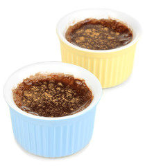 Chocolate pudding in bowls for baking isolated on white