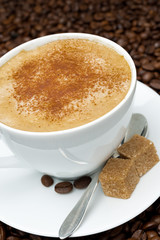 cup of cappuccino with brown sugar