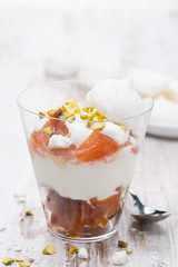 dessert with canned peaches, whipped cream and meringue, closeup