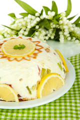 Delicious jelly cake on table close-up