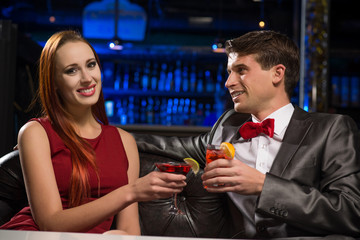 Young couple talking in a nightclub