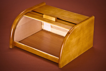  wooden bread box on brown backgroud