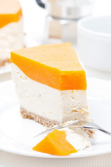 piece of cheesecake with pumpkin jelly, vertical, close-up