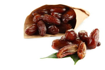 Dried dates in paper cone isolated on white