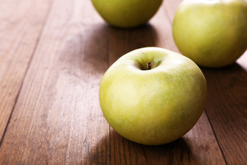 Apples on wooden background