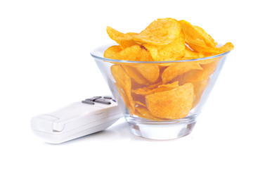 Chips in bowl and TV remote isolated on white