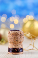 Champagne cork on Christmas lights background