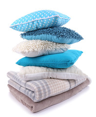 Colorful pillows and plaids isolated on white