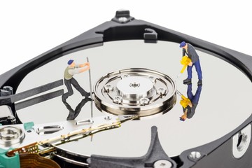 Hacking or repairing a computer hard disc drive concept