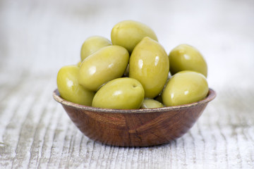 Bowl with fresh green olives