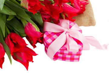 pile of red  tulips with gift box