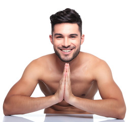 Fototapeta premium young smiling man is praying