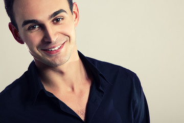 Young cheerful man in black shirt