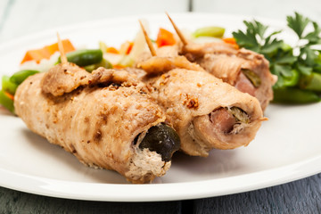 Beef rolls and vegetables