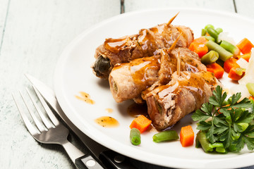 Beef rolls and vegetables