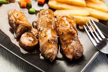 Beef rolls and vegetables