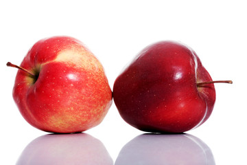 Fototapeta na wymiar Two red apples over white.
