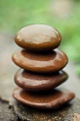 Stones pyramid near river symbolizing zen, harmony, balance. 