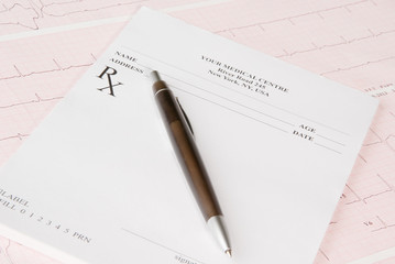 Empty medical prescription on electrocardiogram (ECG) chart