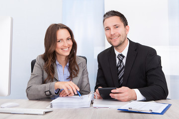 Businesspeople Calculating Finance