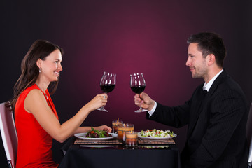 Couple Tossing Wine Glass