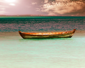 Fototapeta na wymiar A boat in the sea,with a retro effect