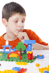 boy playing with color toy
