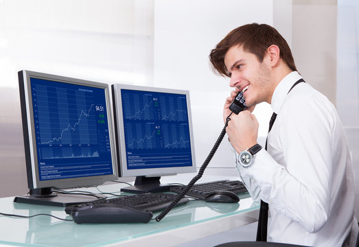 Stock Broker Working At Office