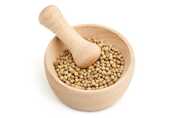 mortar and pestle with white peppercorns