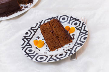 Portion of chocolate cake served on a table
