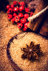 Christmas background with Brown sugar, anise star and cinnamon s
