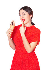 Pretty woman in red dress eating ice cream