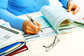 Hands with calculator.