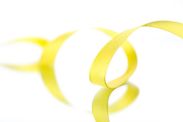Yellow ribbons isolated on white