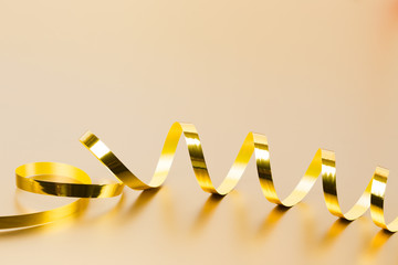 Golden ribbon on golden background