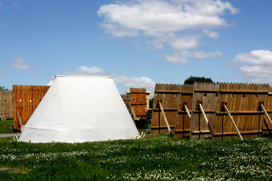 White tent and wooden boards
