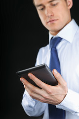 Handsome businessman using computer plane-table