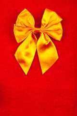 Yellow ribbon on velvet background