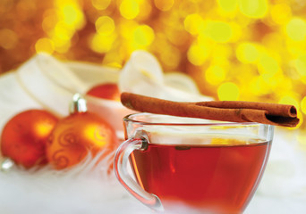 Hot christmas drink with cinnamon sticks