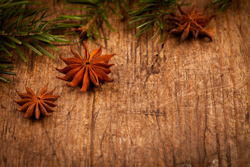 Star anise and branch on wooden background