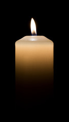 White candle on dark background