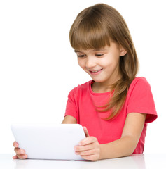 Young girl is using tablet