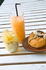 Refreshing cold frappe coffee and Chocolate bun in coffee shop