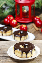 Christmas donut with chocolate on wooden table. Beautiful xmas