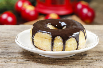 Christmas donut with chocolate on wooden table. Beautiful xmas