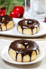 Christmas donut with chocolate on wooden table. Beautiful xmas