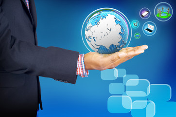 businessman holding business world