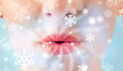 Pretty woman mouth blowing cold breeze