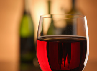 A glass of wine and a bottle